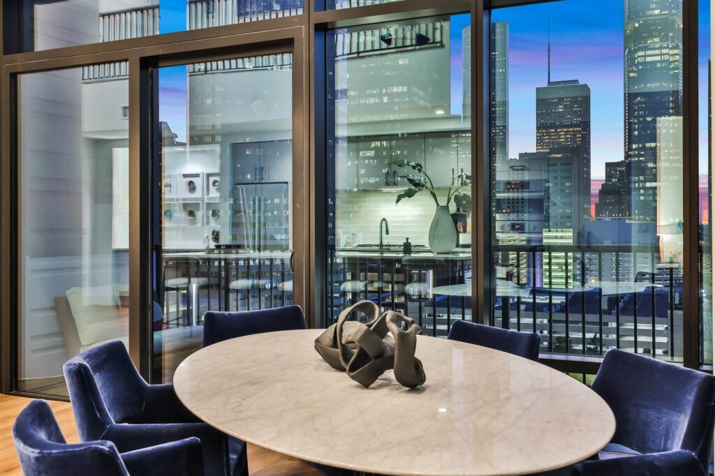 Dining room with dining table seating, hard-wood style flooring, and exterior view of city